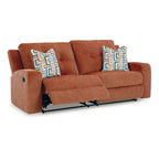 Canapé inclinable manuel en polyester couleur épice-orangée avec dossier capitonné et 2 coussins décoratifs, 3 places