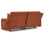 Canapé inclinable manuel en polyester couleur épice-orangée avec dossier capitonné et 2 coussins décoratifs, 3 places